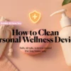 Cleaning kit with pouch, pump bottle, and pink silicone device on a blush background with a safety shield icon